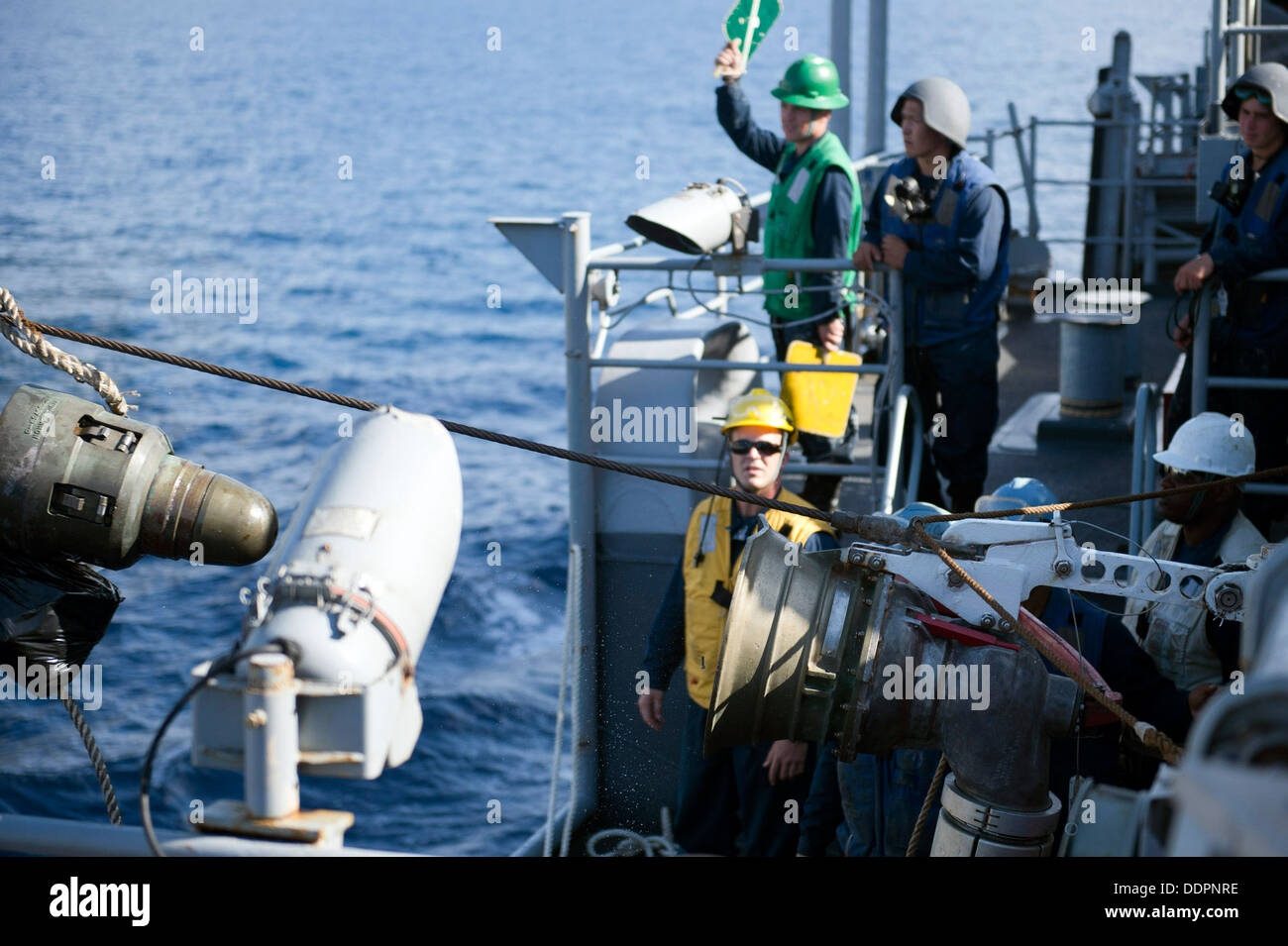 A refueling nozzle disengages from a receiver aboard amphibious ...