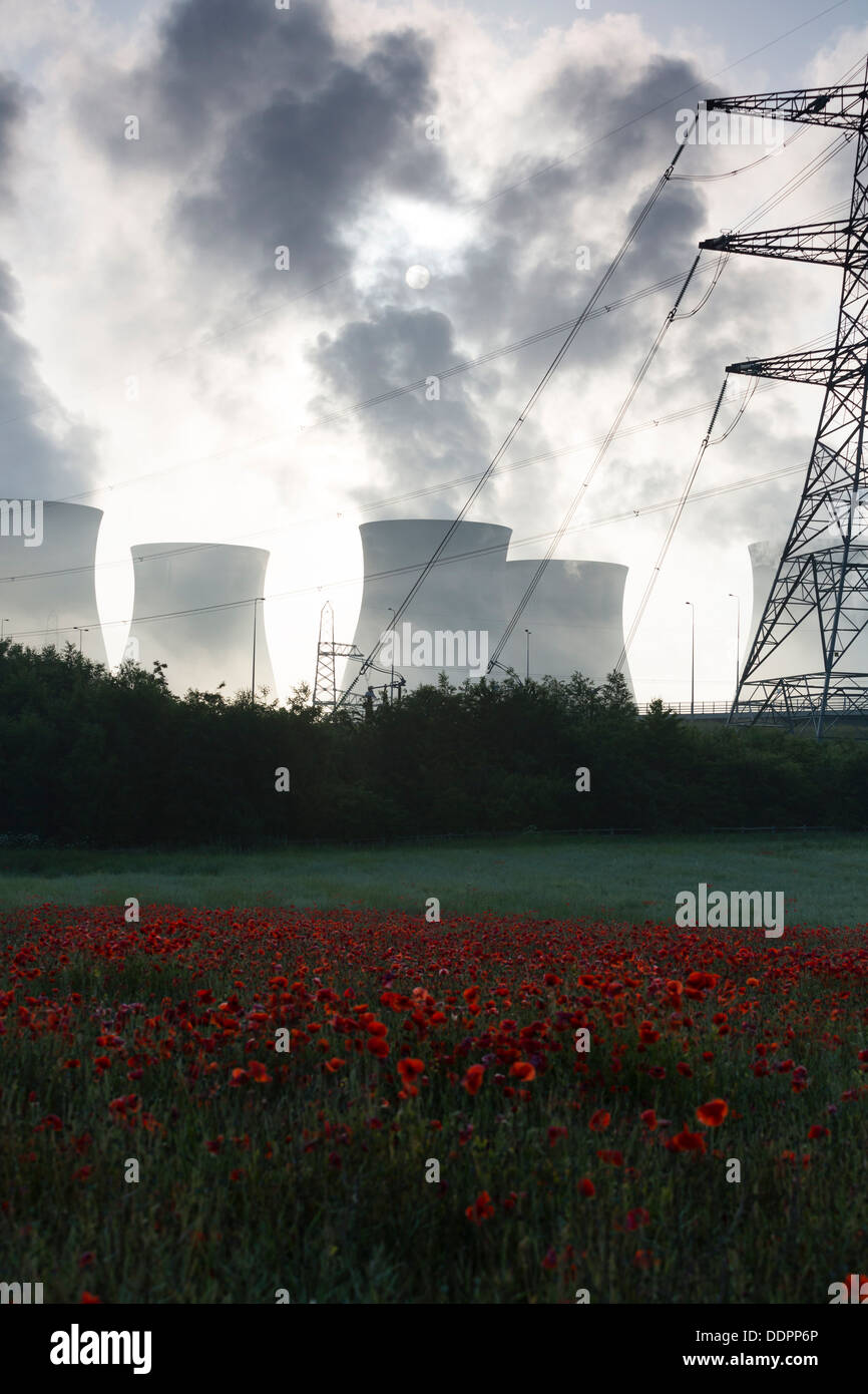 Ferrybridge C coal fired power station in West Yorkshire, with a field of red poppies in the foreground. Stock Photo