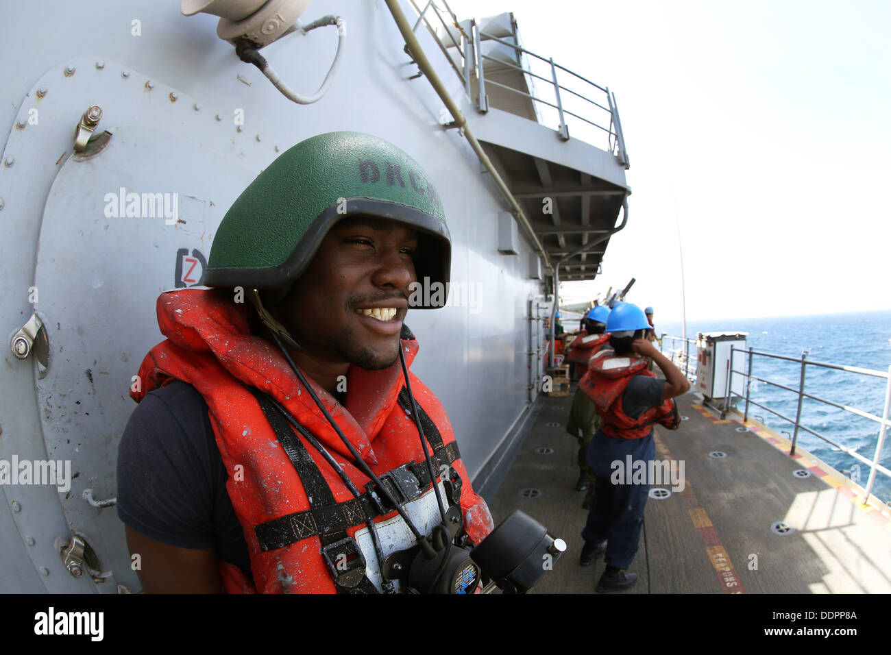 Seaman Apprentice David Shumake Jr. uses a soundpowered phone during a