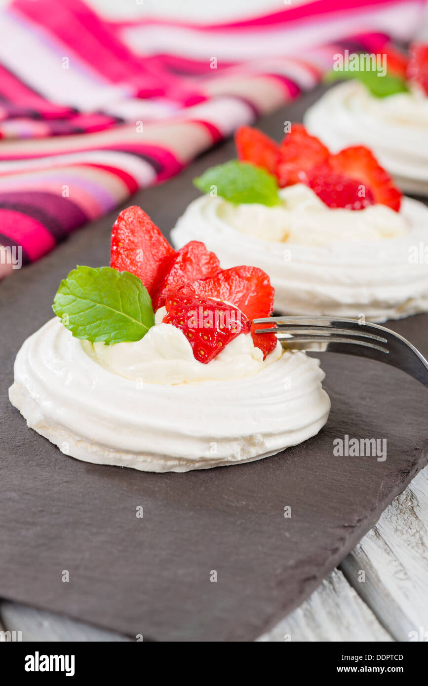 Strawberry Meringue Nests Meringue discs topped with whipped cream