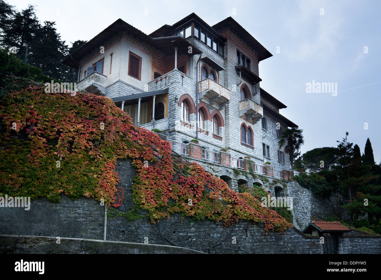 Front and side view of large, multilevel old house in Northern italy