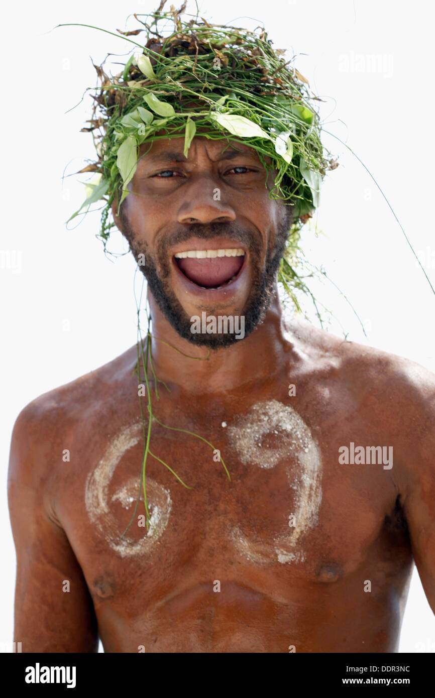 Portrait Of Melanesian Men With Green Hair Dress Made Of