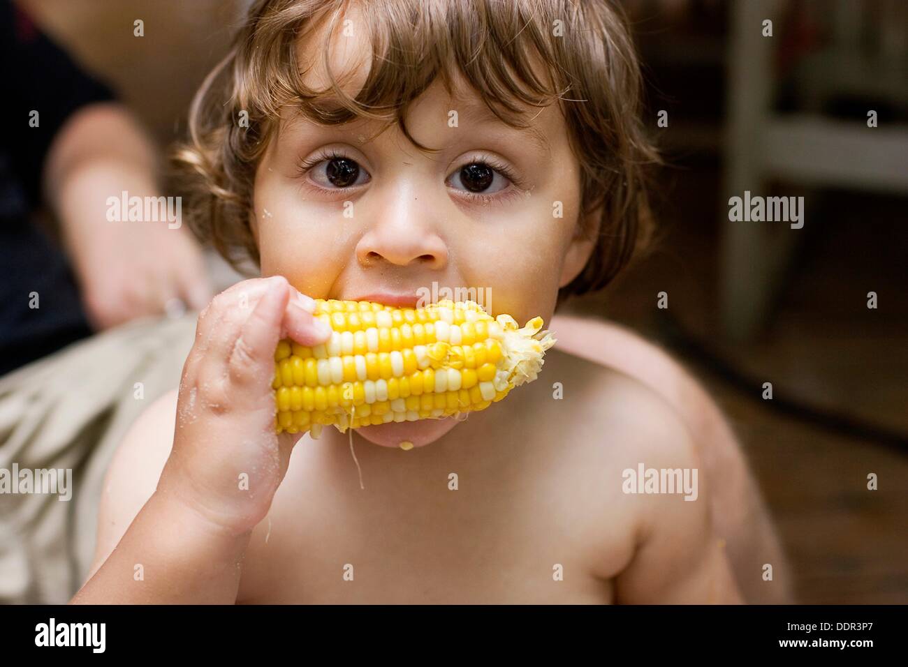Child eating cornonthecob Stock Photo Alamy