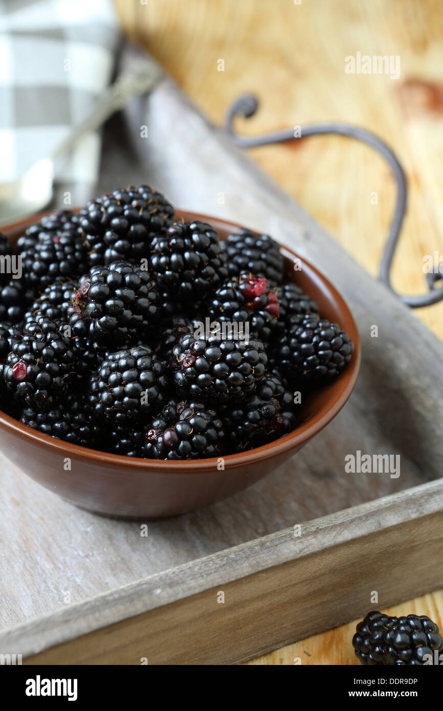 ripe blackberries in a bowl, food close up Stock Photo
