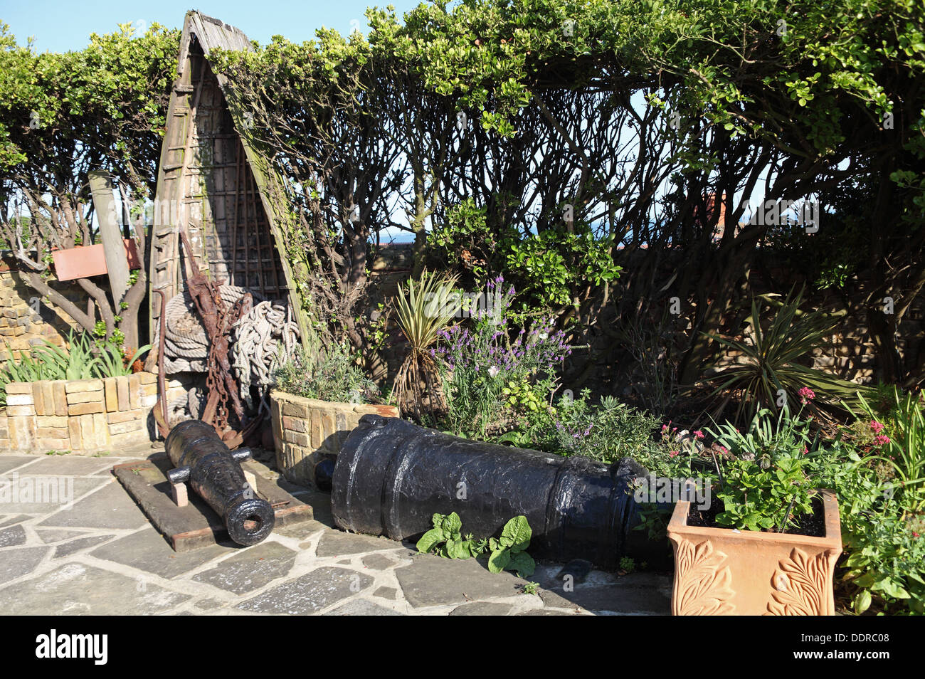 Garden with old cannon, in Charles Dickens Bleak House, Broadstairs, Kent, England Stock Photo