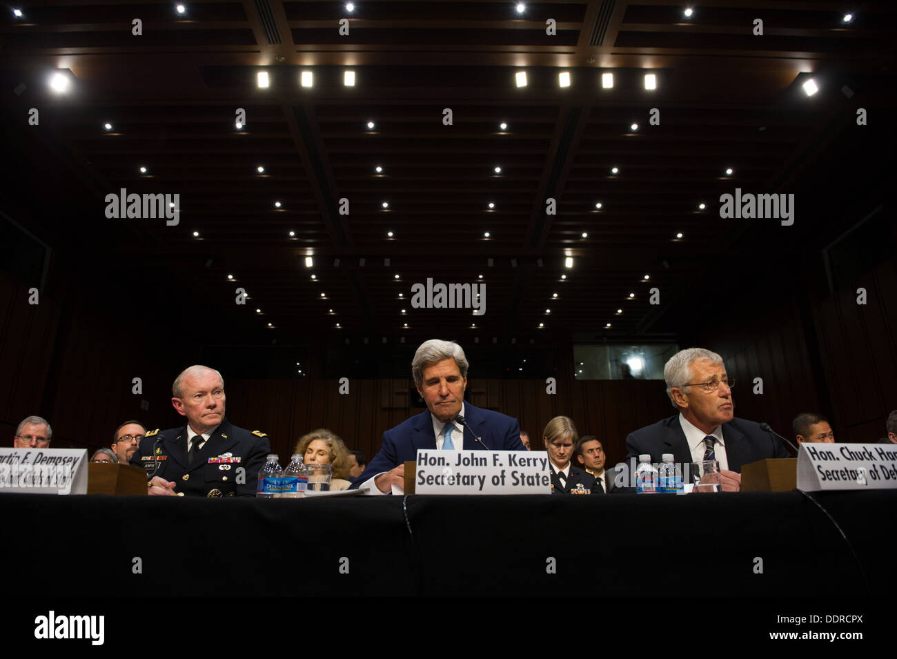 Chairman of the Joint Chiefs of Staff Martin E. Dempsey, Secretary of State John Kerry and Secretary of Defense Chuck Hagel look on during a Senate Foreign Relations Committee hearing at the Hart Senate Office building in Washington D.C. Sept. 3, 2013. Pr Stock Photo