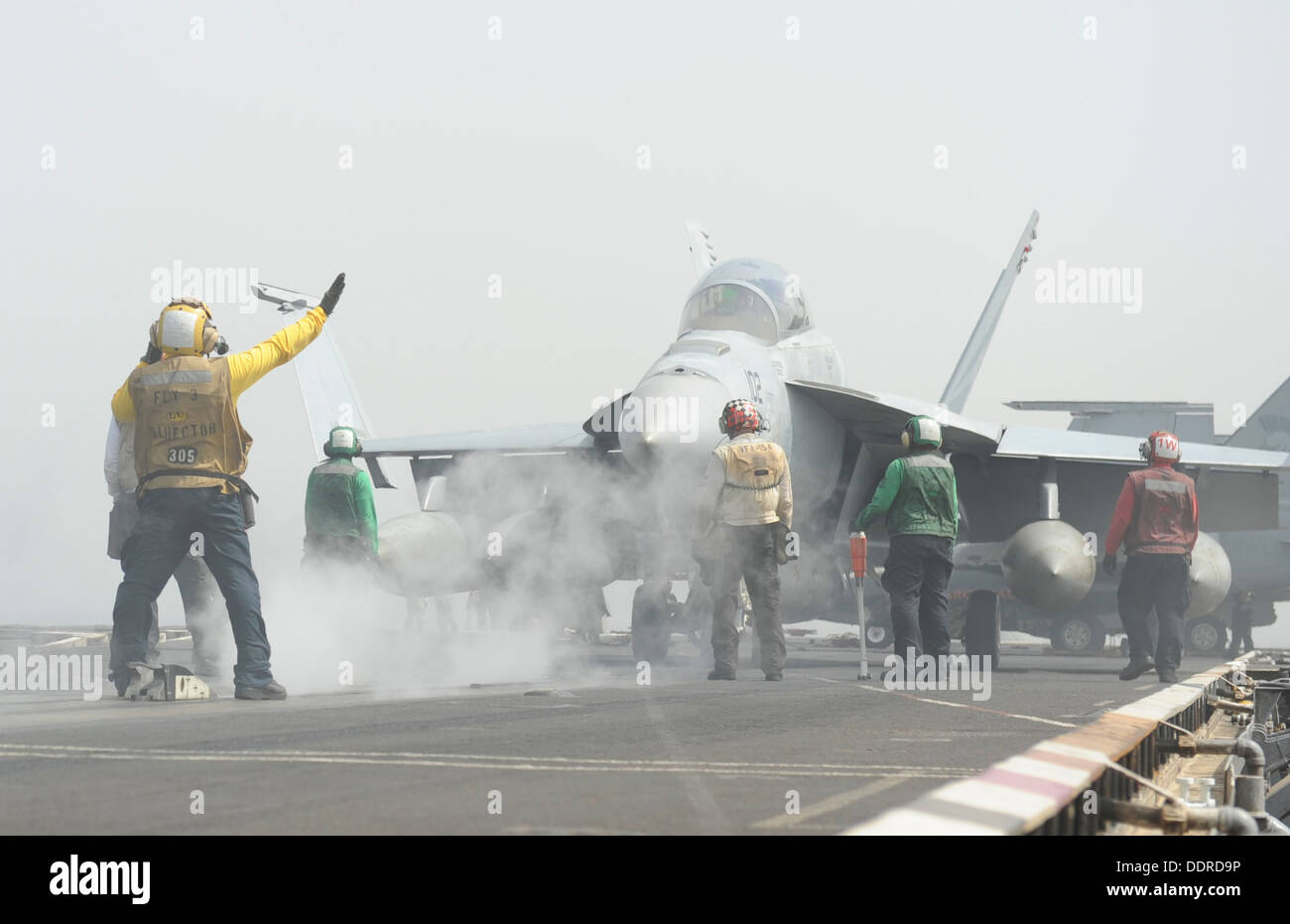F/A-18F Super Hornet assigned to the Black Knights of Strike Fighter Squadron (VFA) 154 prepares to launch from the flight deck Stock Photo