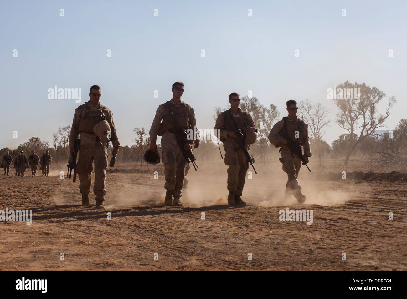 Marines with Company E., Battalion Landing Team 2nd Battalion, 4th Marines, 31st Marines Expeditionary Unit, walk back from the Stock Photo
