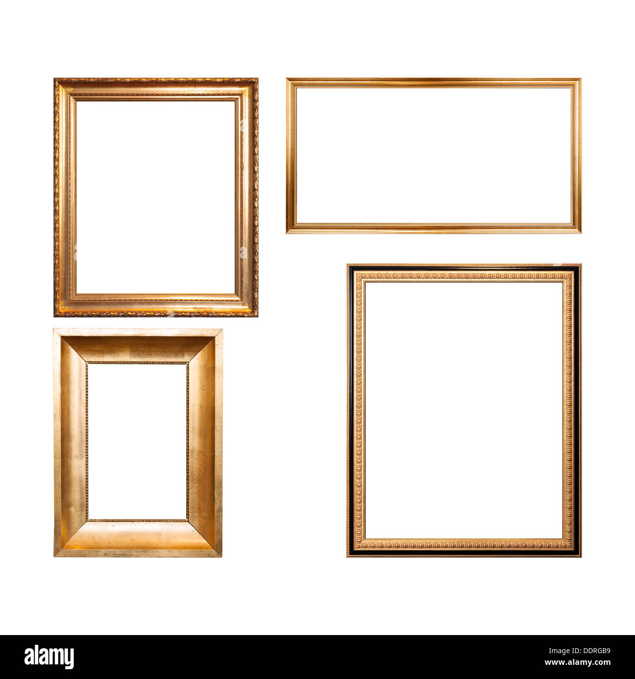 Set of four empty wooden frames painted with gold paint isolated on white Stock Photo