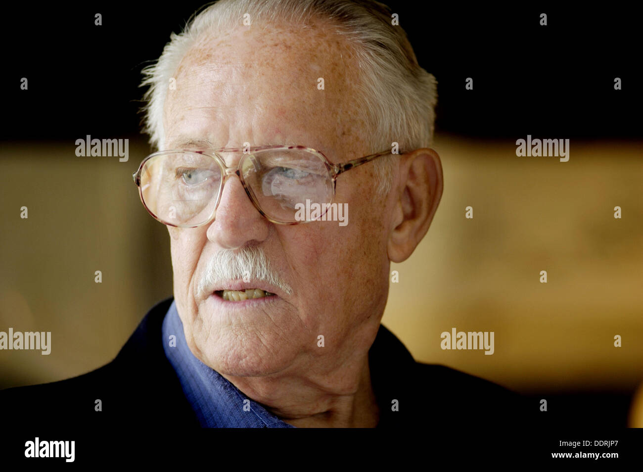 Man at a family gathering with relatives Stock Photo Alamy