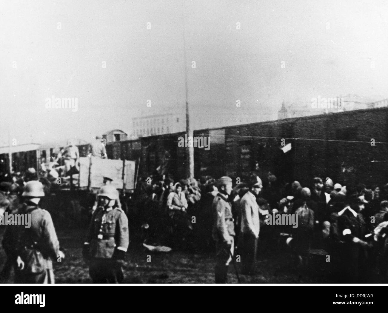 Nazism / National Socialism,serious crime,persecution of the Jews,Warsaw Ghetto,evacuation 1942 - 1943,Polish Jews are sent into freight cars by SS and Ordnungspolizei,Gdansk Railway Station,Warsaw,photograph the Jewish underground movement,August 1942,deportation,deportations,reloading point,trans-shipment centre,reloading points,trans-shipment centres,wagon,transport,transportation,liquidation,the Final Solution the Jewish question,action Reinhardt,holocaust,Nazi,Nazis,railway,railroad,railways,railroads,Reichsbahn,order police,,Additional-Rights-Clearences-Not Available Stock Photo