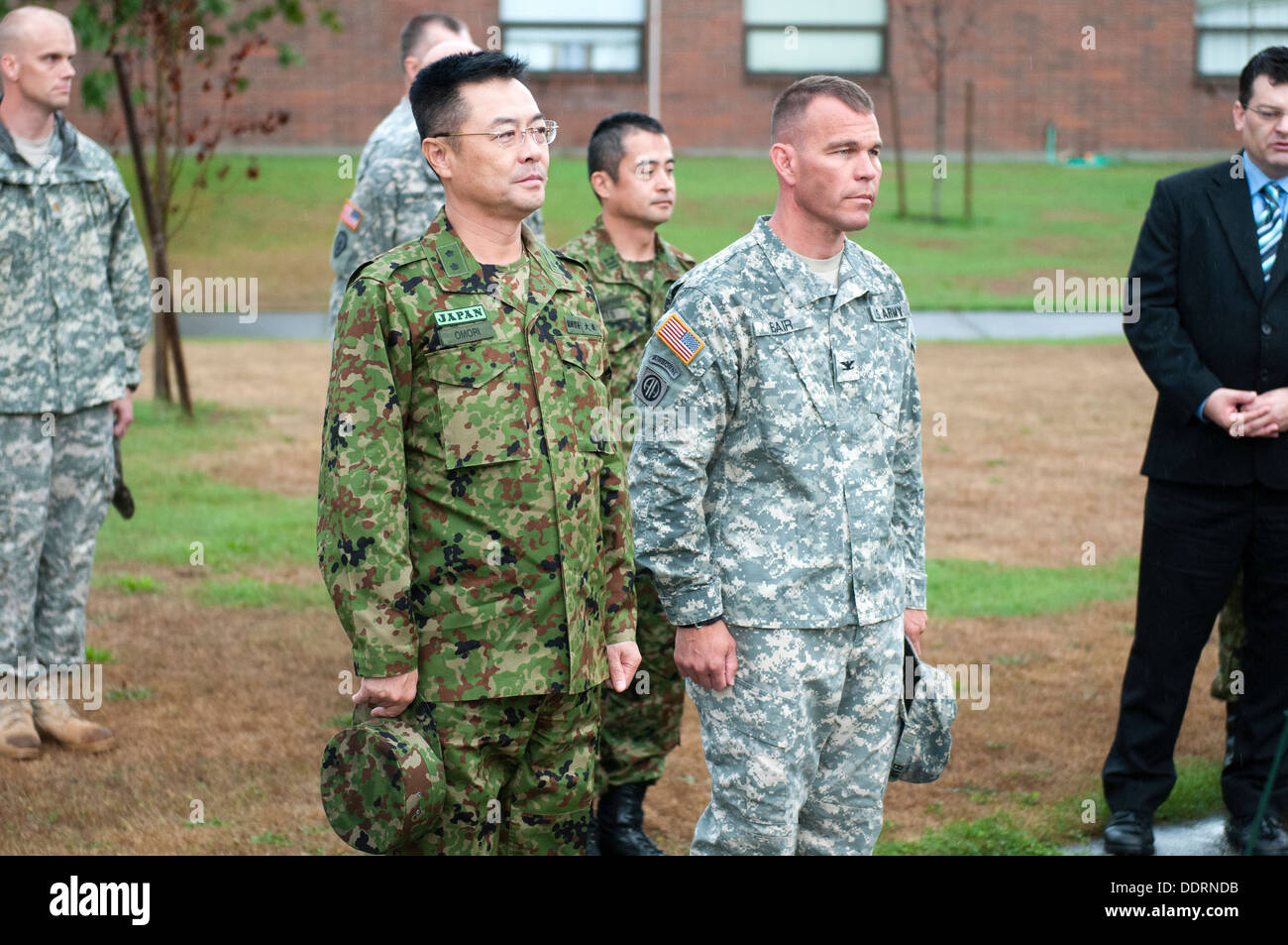 Maj. Gen. Omori (left), deputy commanding general, 4th Division, Northern Army, Japanese Ground Self-Defense Force, stands alongside Col. Hugh D. Bair, commander, 3rd Stryker Brigade Combat Team, 2nd Infantry Division, at a wreath laying ceremony held at Stock Photo