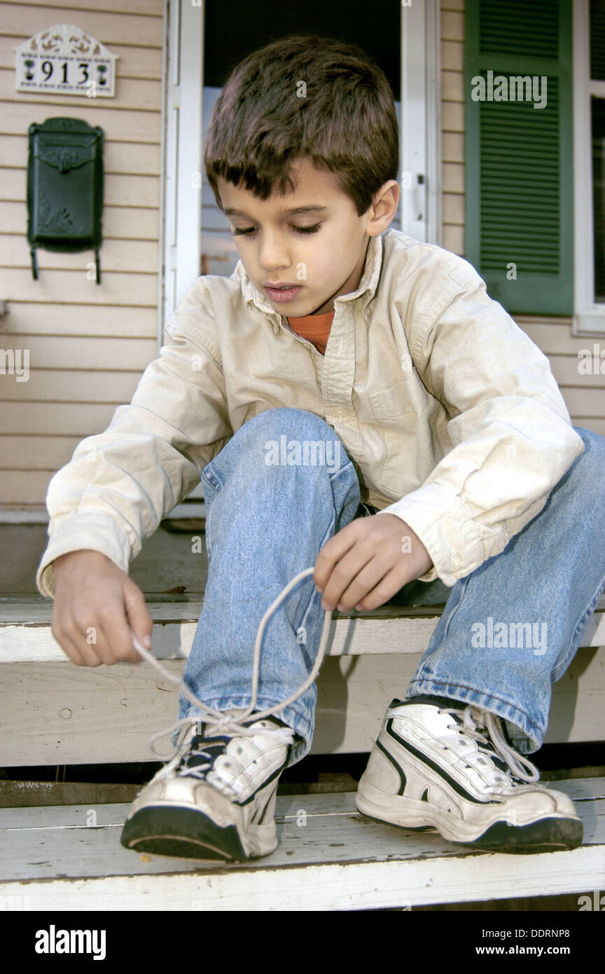 Boy lacing shoes hires stock photography and images Alamy