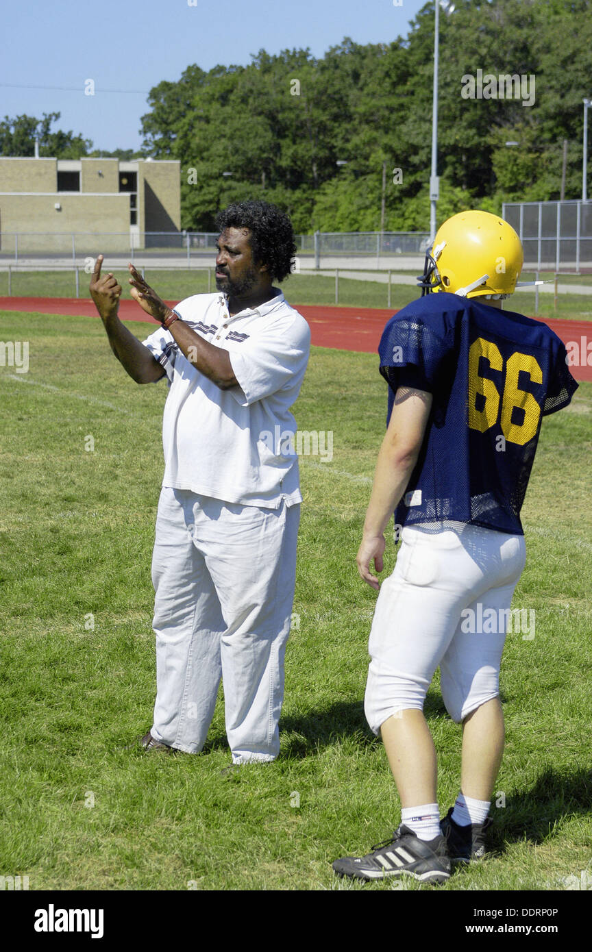 Deaf football player reads sign language given by black aid during practice Stock Photo Alamy