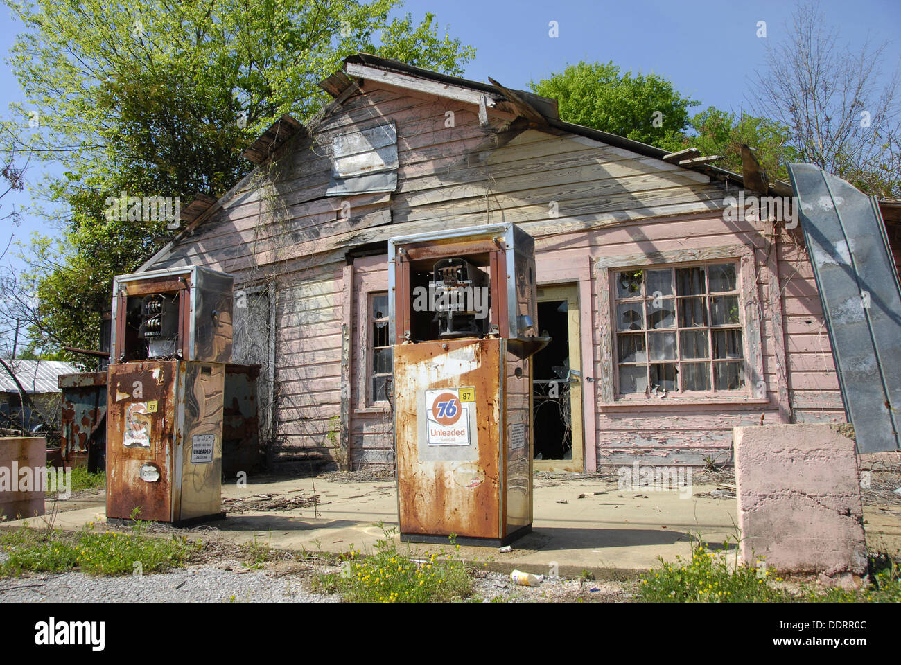 Old run down gas station with rusted pumps on the road from Selma to