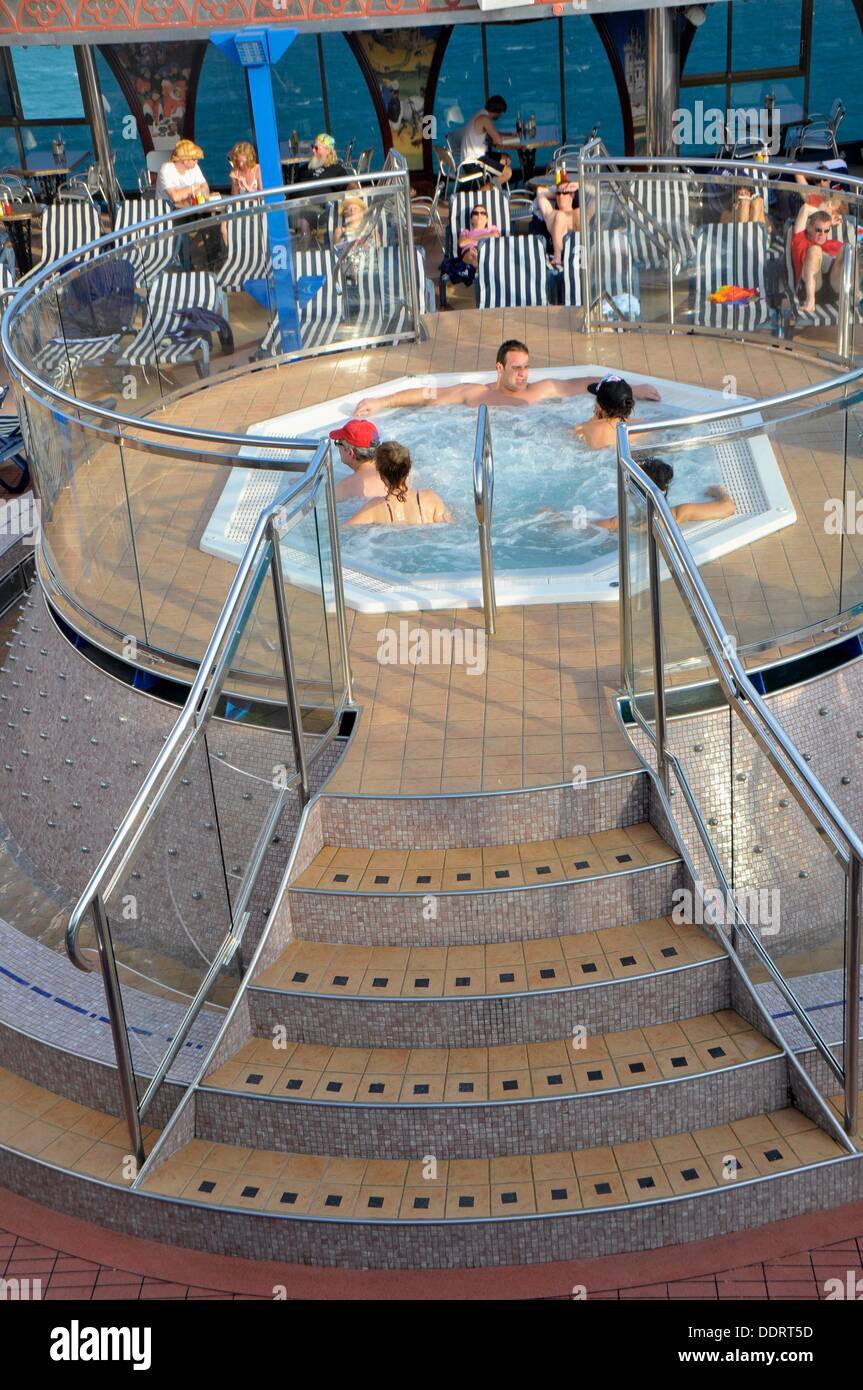 Adults enjoy whirlpool on Caribbean Cruise Ship Stock Photo