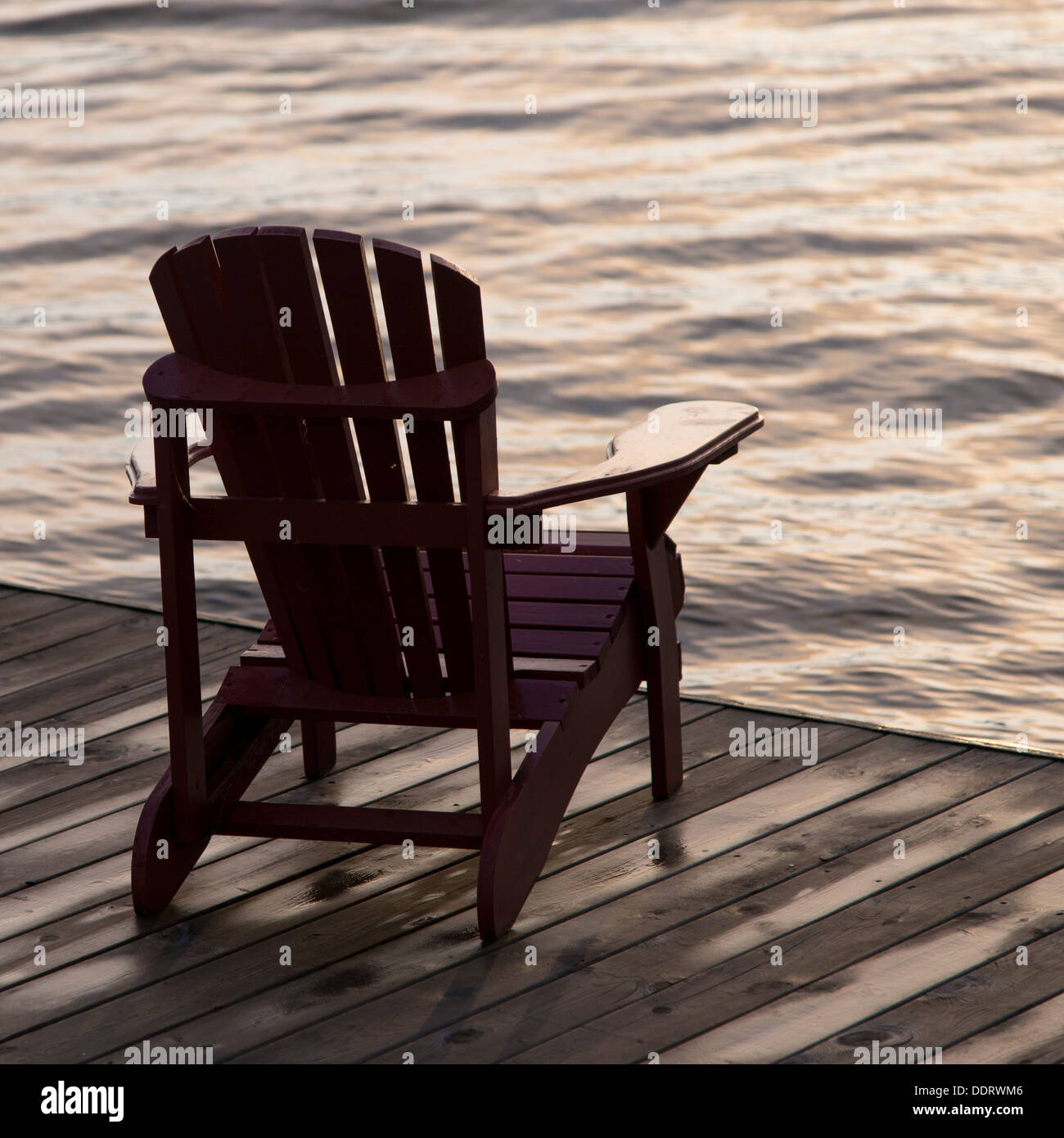 Adirondack chair on a dock at the Lake of The Woods, Ontario, Canada