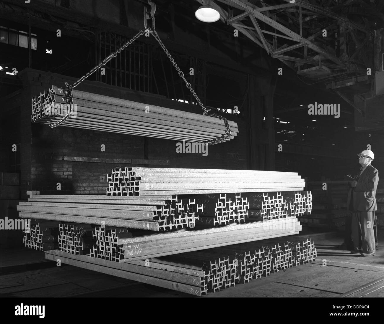 Steel 'H' girders being stacked for distribution, Park Gate, Rotherham, South Yorkshire, 1964. Artist: Michael Walters Stock Photo