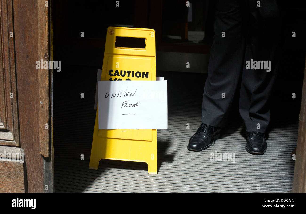 Walkie Talkie building in London that caused heat spot from concentric  design sign caution uneven floor melted by sun heat Stock Photo - Alamy