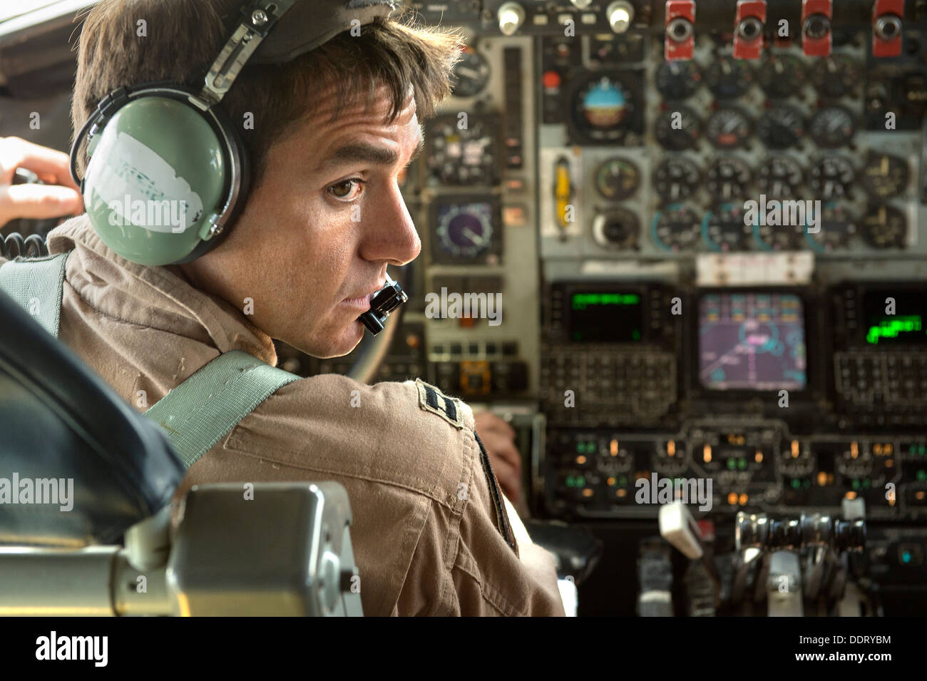 KC135 pilot, communicates with crew members during a refueling mission