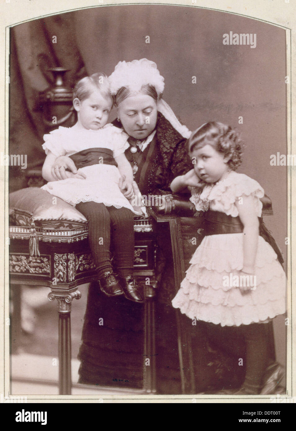 Queen Victoria with two of her grandchildren, April 1886. Artist: Alexander Bassano Stock Photo