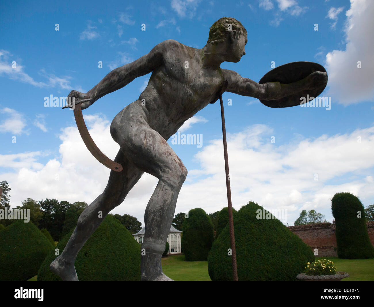 Burton Agnes Hall garden sculpture of a Gladiator with curved sword and small shield Stock Photo
