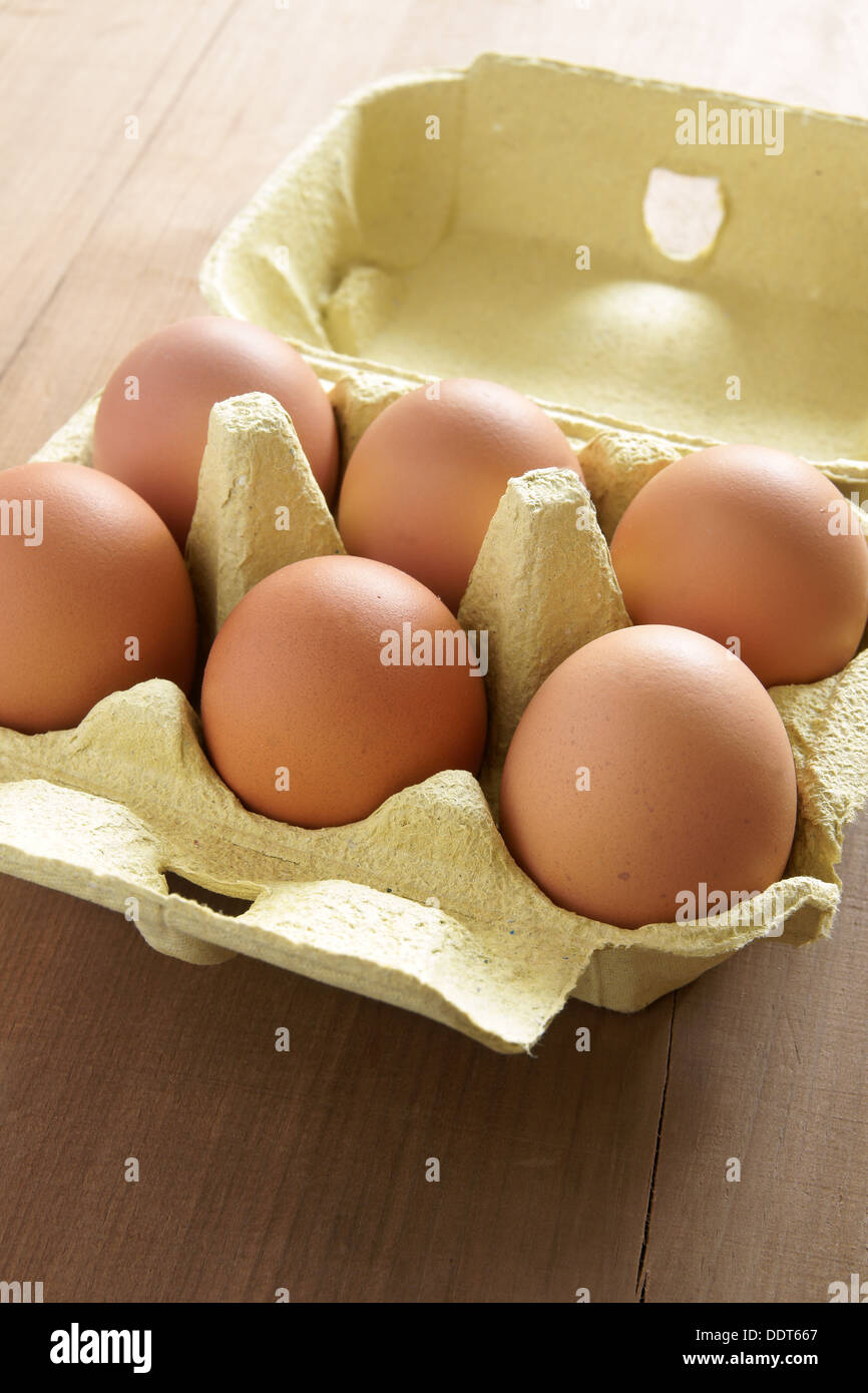 Fresh farm eggs in an egg box Stock Photo