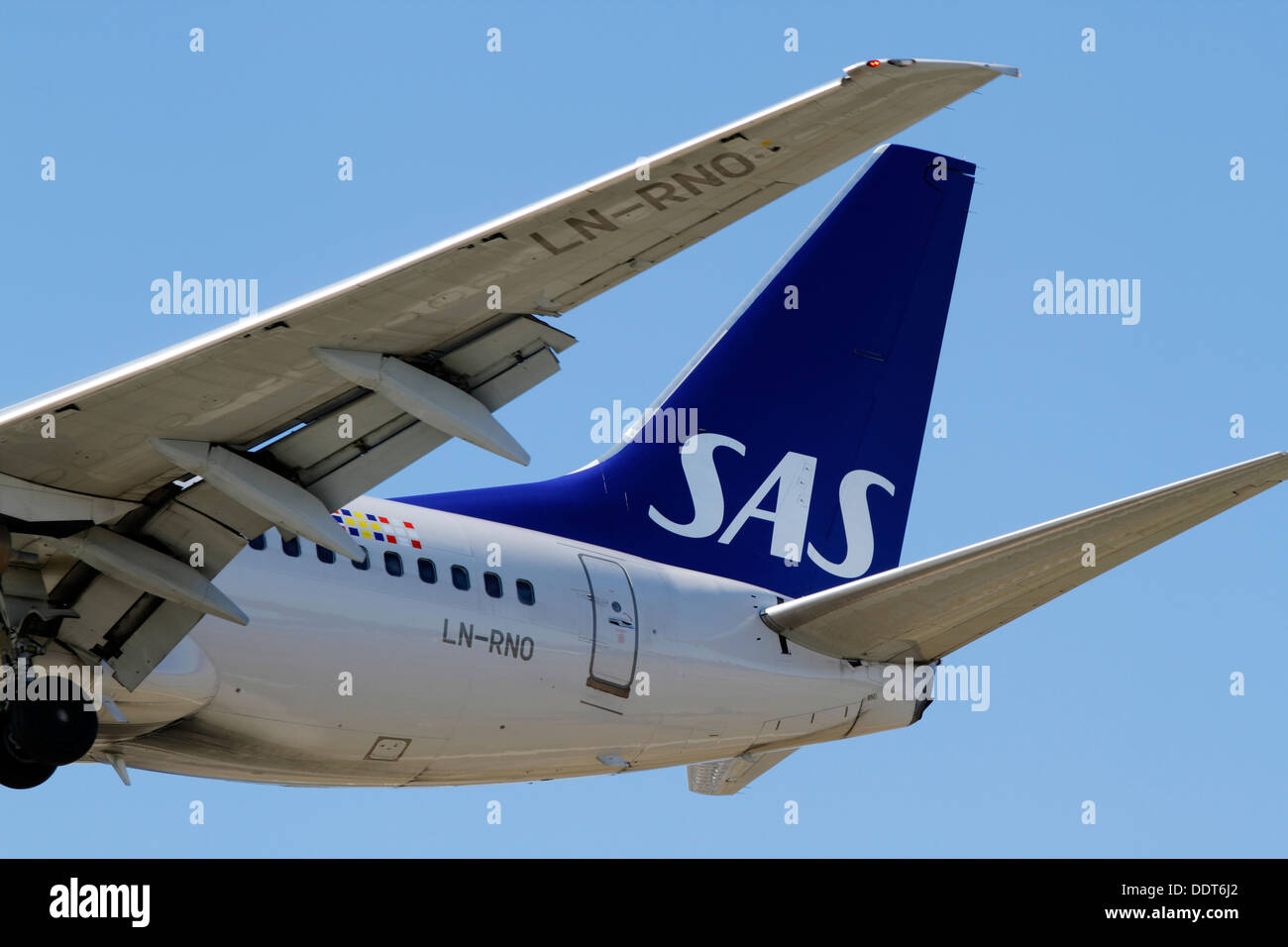 Rear part and SAS logo of Scandinavian Airlines Boeing 737-783, LN-RNO,  on final approach to Copenhagen Airport Stock Photo