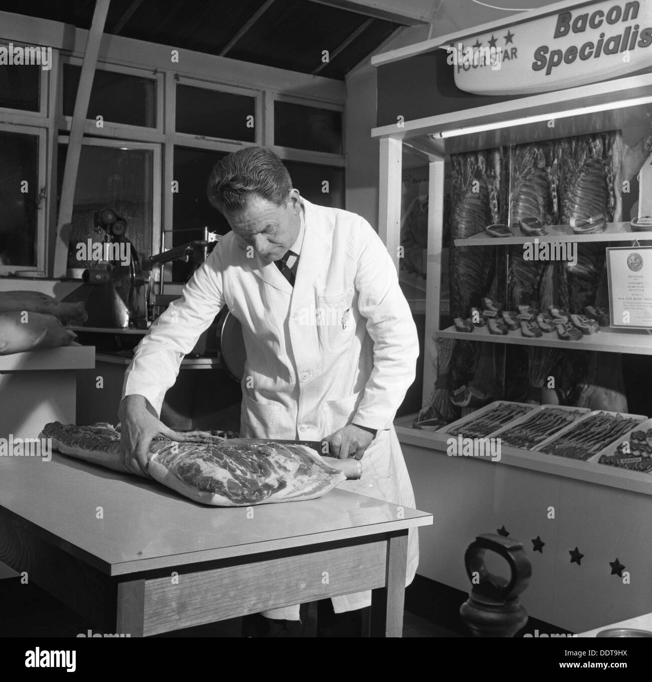 Butcher from Danish Bacon giving a demonstration, Kilnhurst, South Yorkshire, 1961.  Artist: Michael Walters Stock Photo