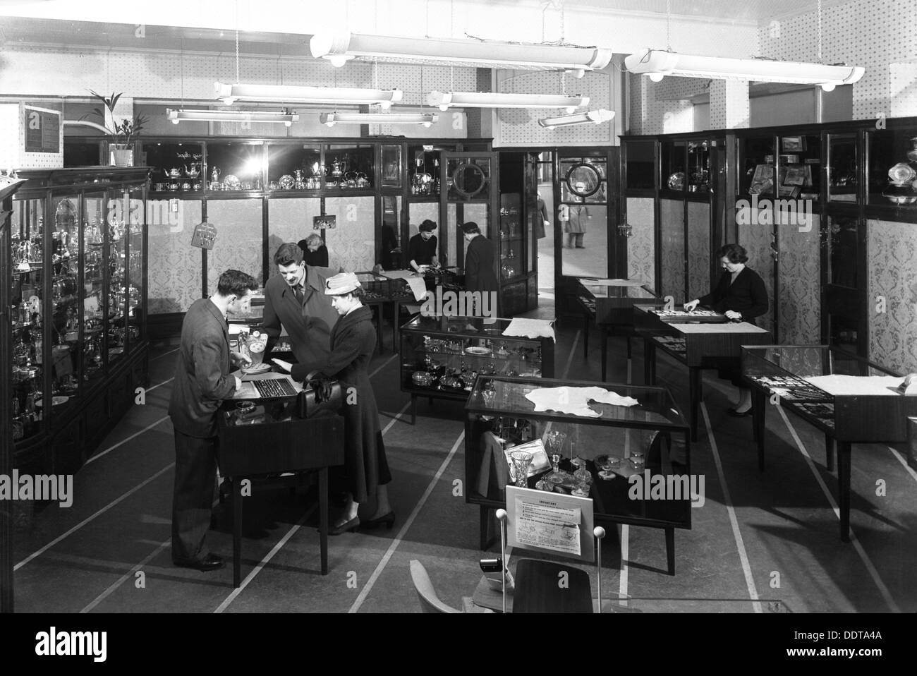 Customers in the Barnsley Co-op jewellery department, South Yorkshire, 1957.   Artist: Michael Walters Stock Photo