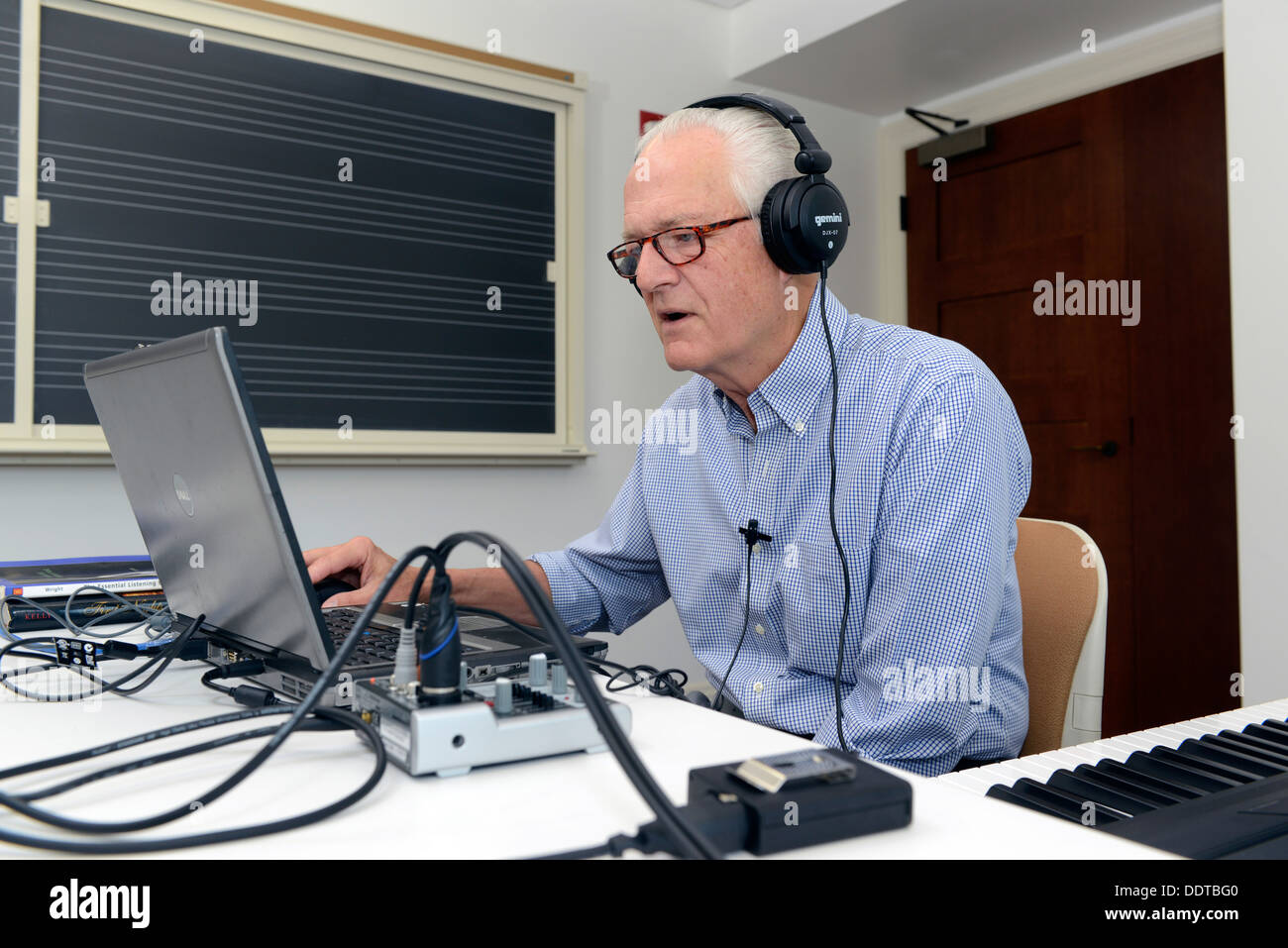 Yale Professor of Music Craig Wright teaches his online 'Listening to Music' class, with students from all over the world. Stock Photo