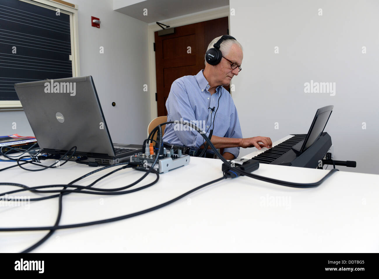 Yale Professor of Music Craig Wright teaches his online 'Listening to Music' class, with students from all over the world. Stock Photo