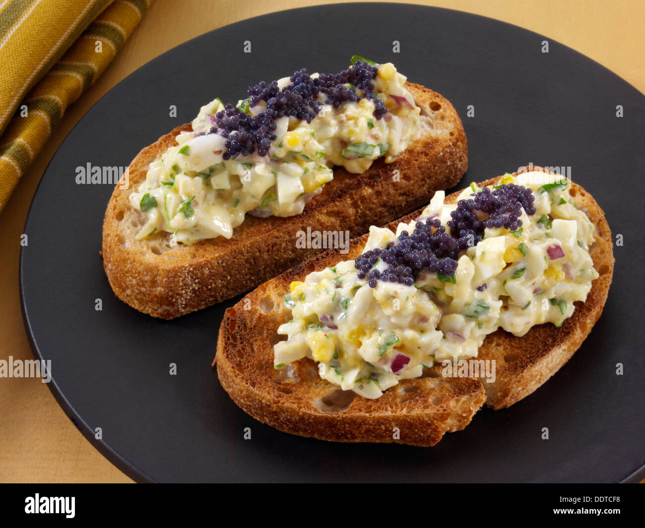 Egg fennel salad with caviar on sourdough toast Stock Photo Alamy