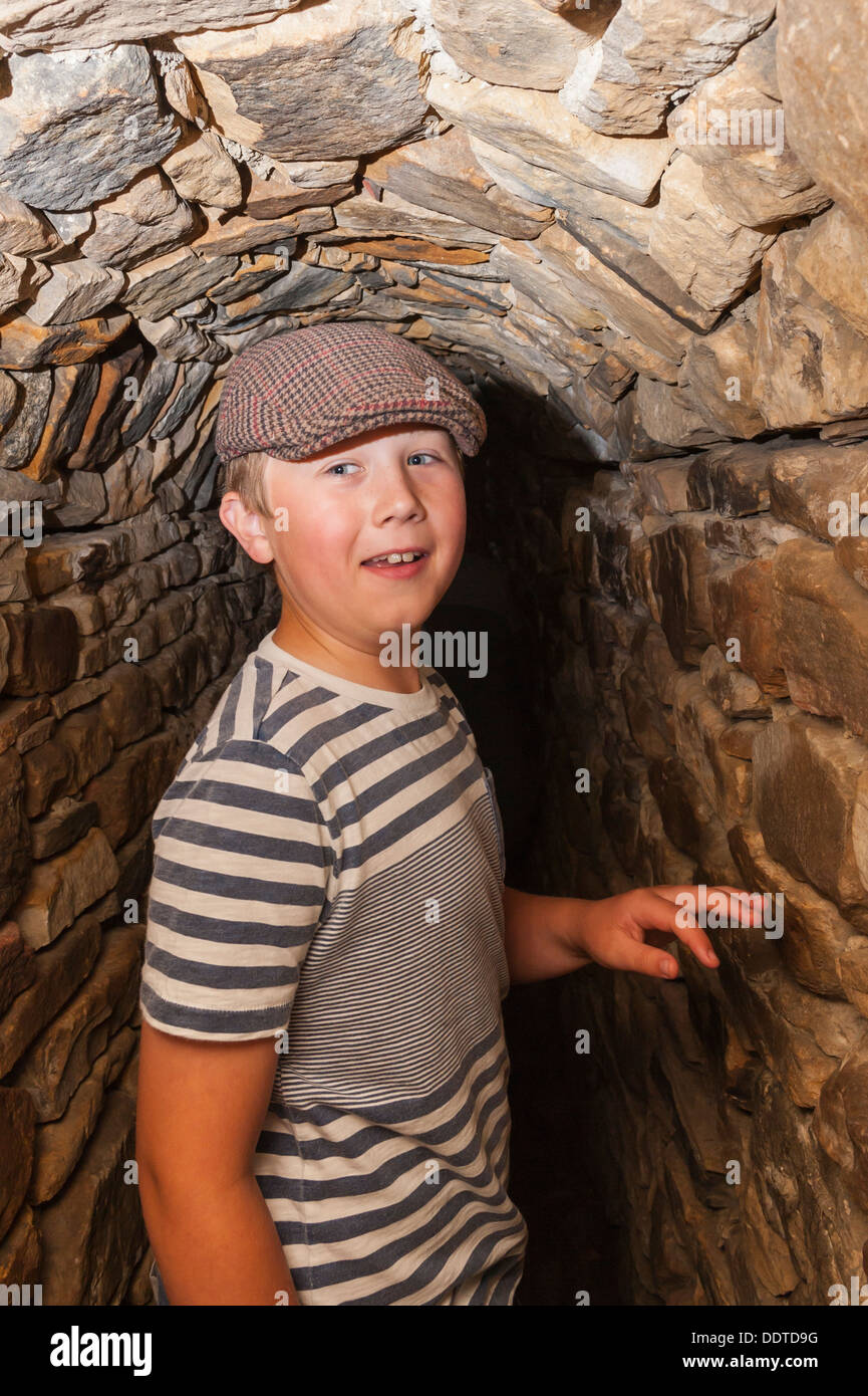 A 9 year old boy at The Forbidden Corner in Middleham , Leyburn , North Yorkshire , England , Britain , Uk Stock Photo