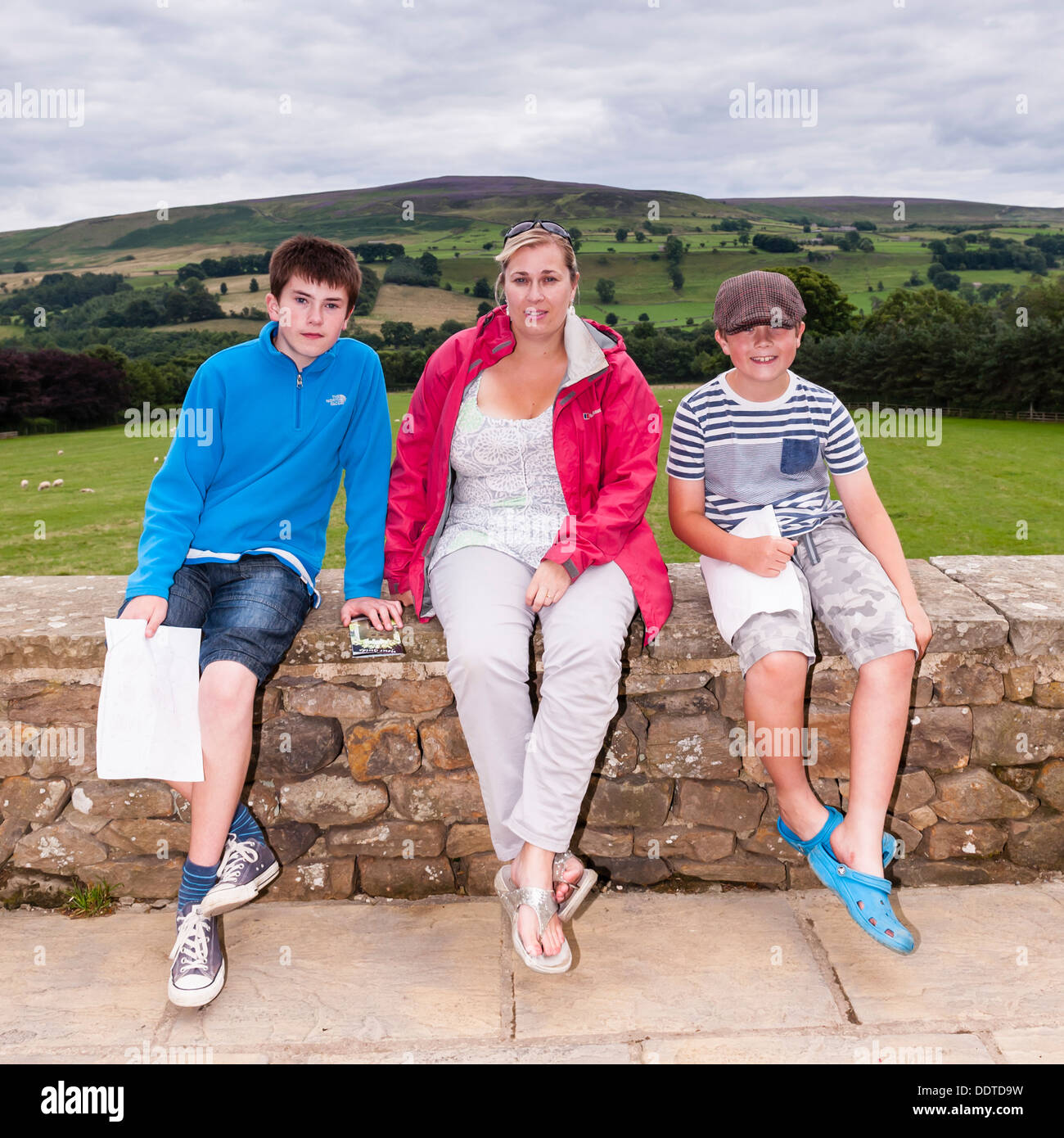 A mother and sons at The Forbidden Corner in Middleham , Leyburn , North Yorkshire , England , Britain , Uk Stock Photo