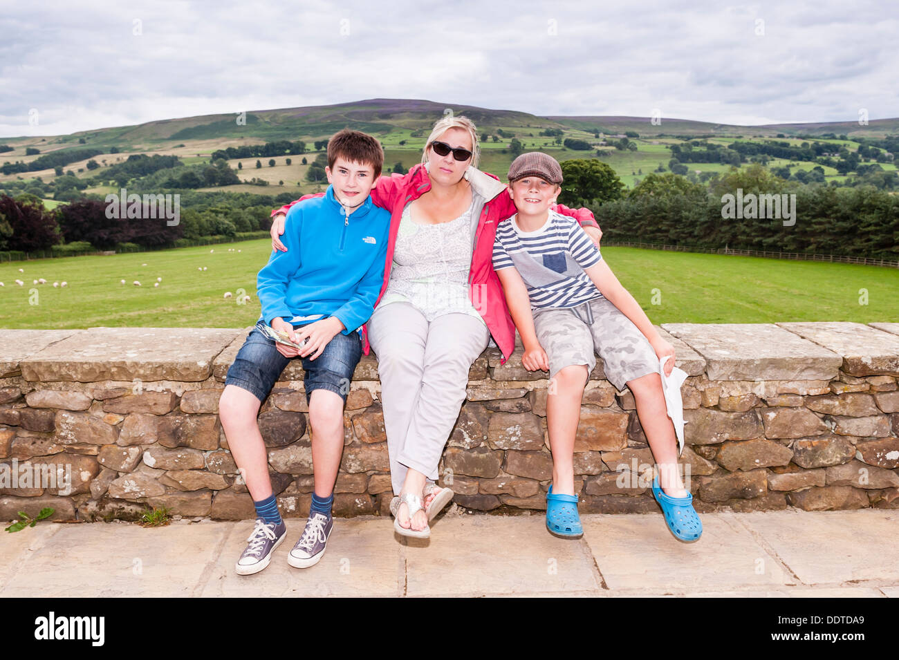 A mother and sons at The Forbidden Corner in Middleham , Leyburn , North Yorkshire , England , Britain , Uk Stock Photo