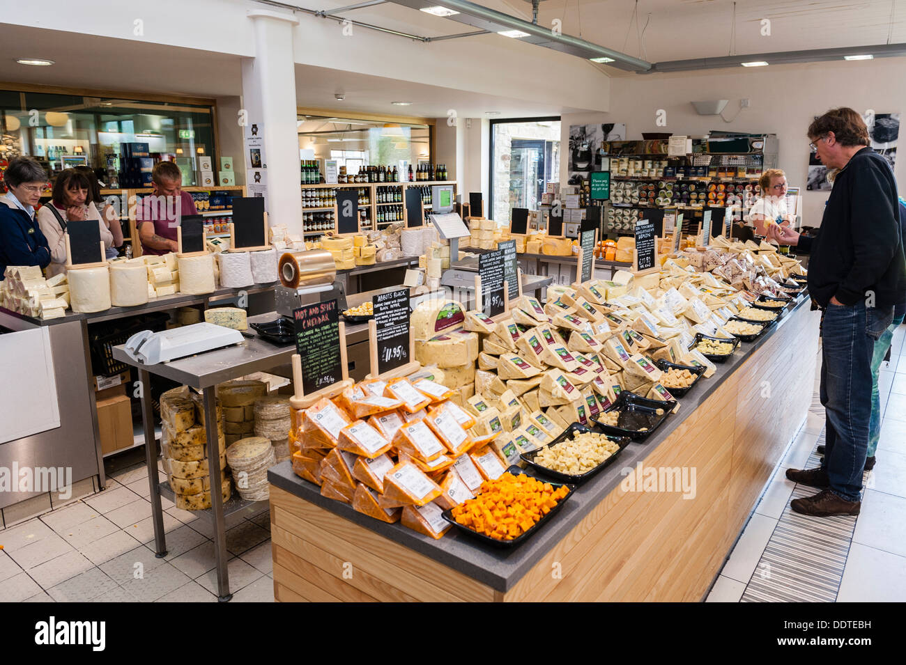 People tasting cheese in The cheese shop in the Wensleydale Creamery