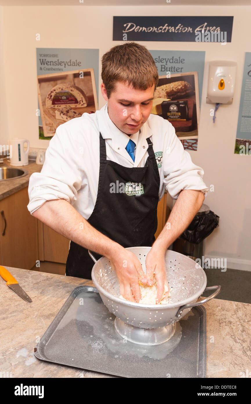 A man demonstrates how to make cheese in the Wensleydale Creamery
