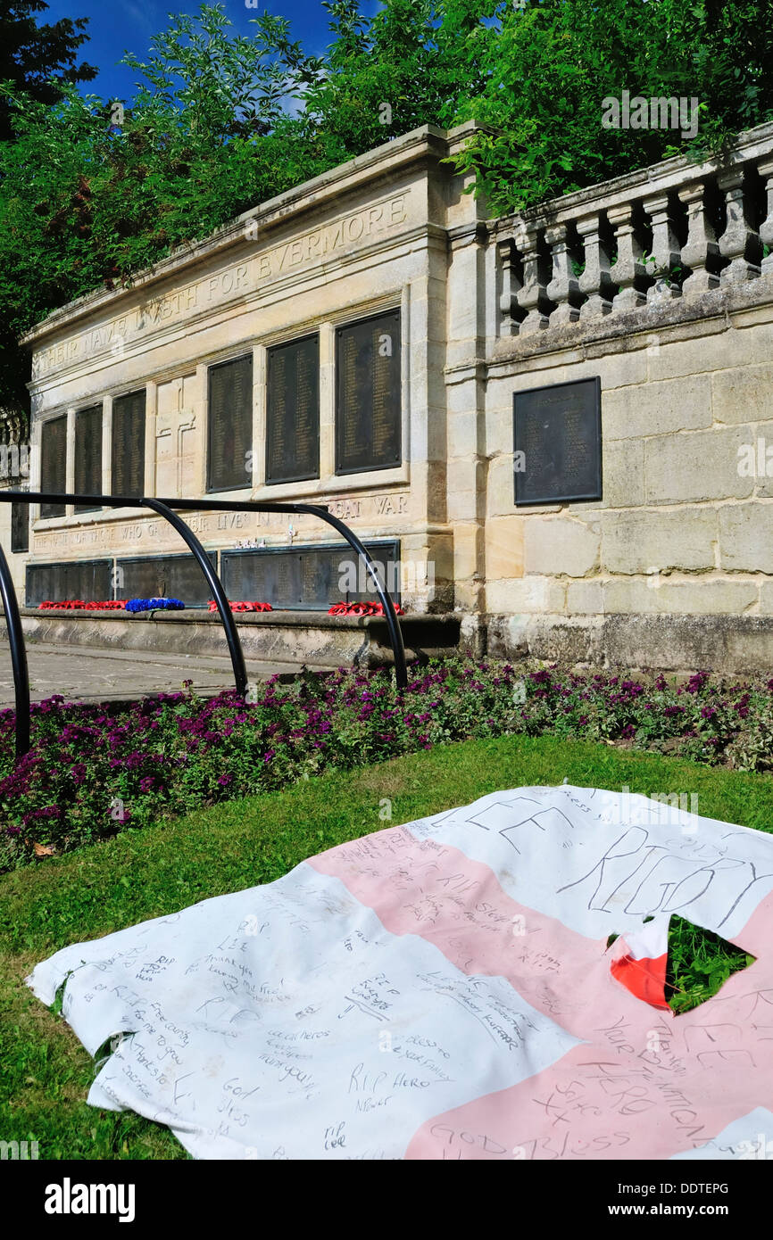 England flag with tributes to Lee Rigby placed on the grass in front of ...