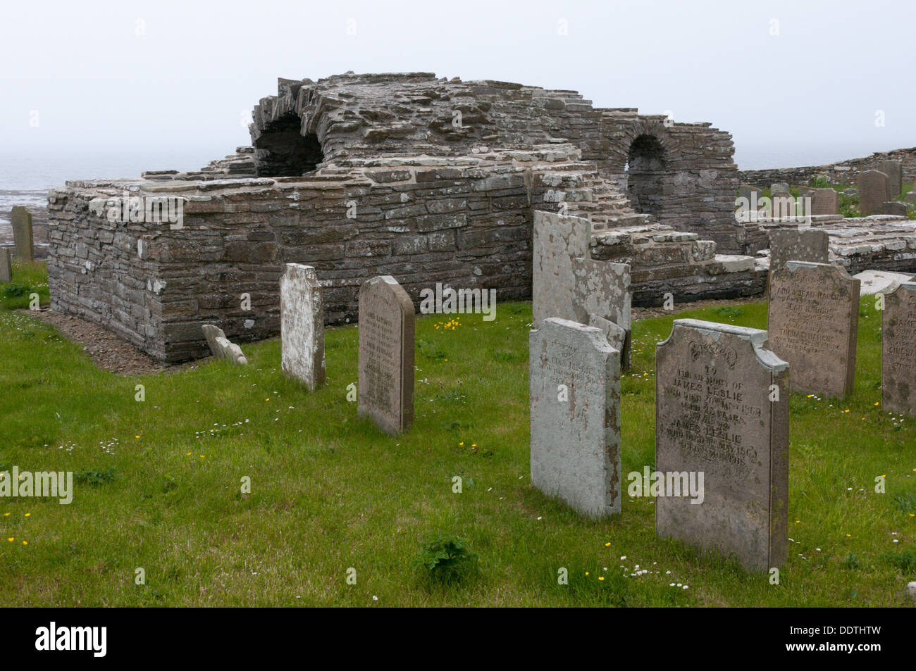 The remains of the 12th century Norse Cross Kirk church at Tuquoy on Westray, Orkney. Stock Photo