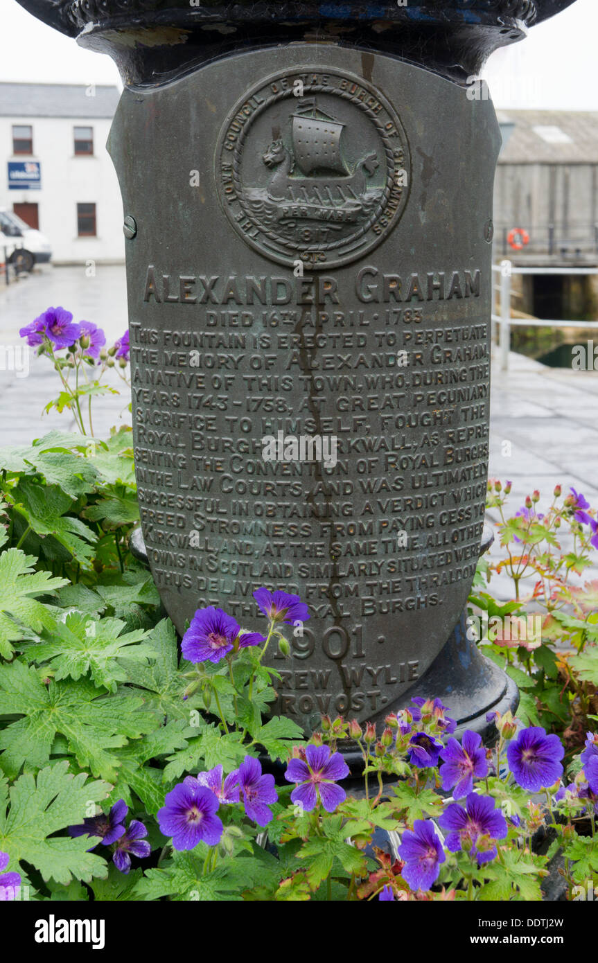 A memorial plaque to Alexander Graham on the Pierhead Fountain in Stromness, Orkney. Stock Photo