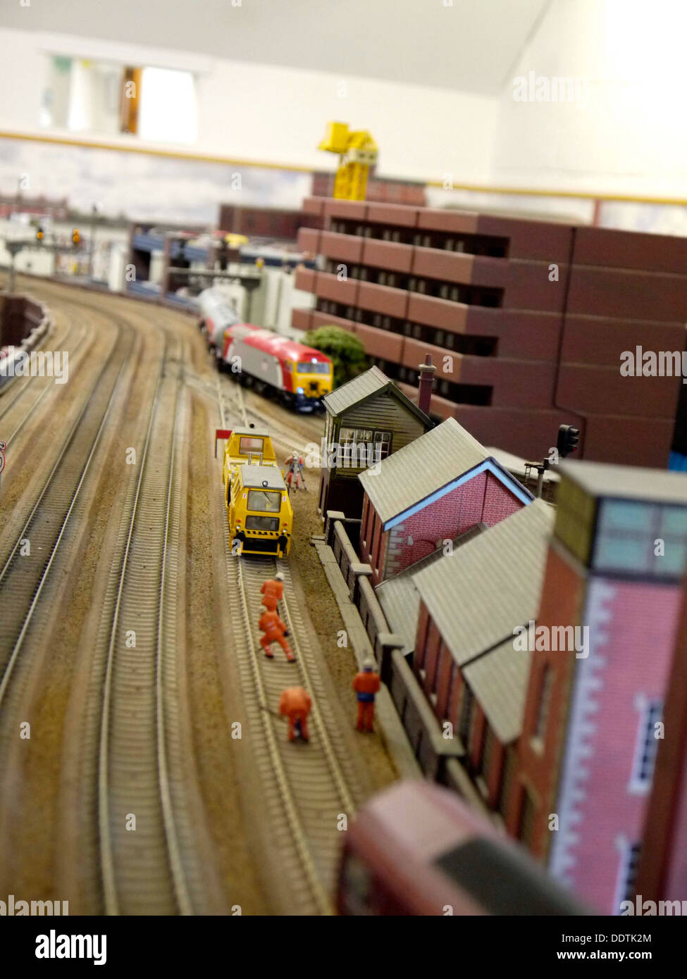 A model railway with workers on the line Stock Photo