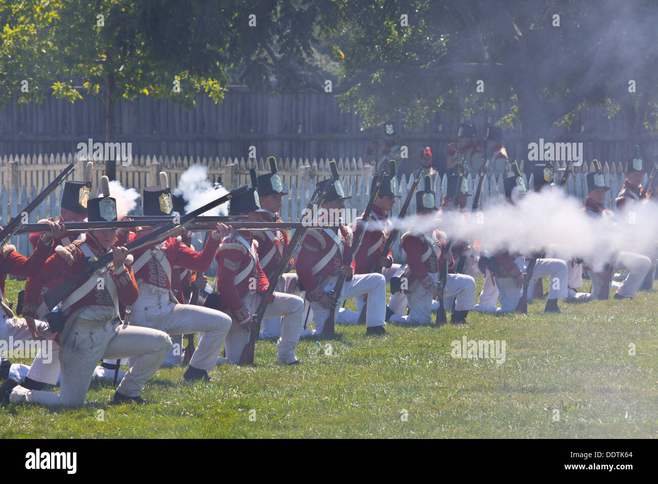 Re-enactment of War of 1812 Fort George Niagara on the Lake Ontario Canada Infantry simulating battle and firing muskets Stock Photo
