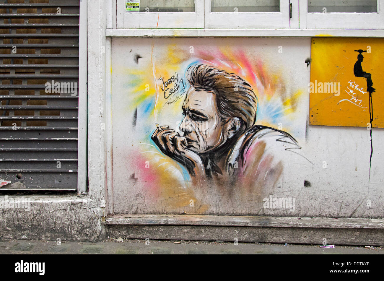 Portrait of Johnny Cash by street artist Paul Don Smith in Hanbury Street, off Brick lane, East London, UK. Stock Photo