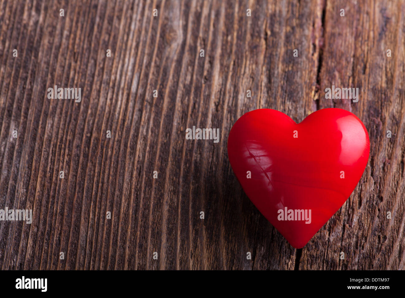 red heart on rough wood Stock Photo