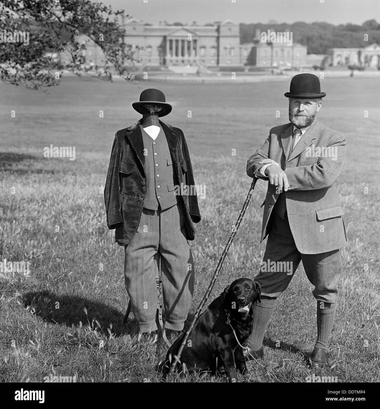 Man in breeches with a dog and a mannequin, Holkham Hall, Norfolk, 1978-1981. Artist: John Gay Stock Photo