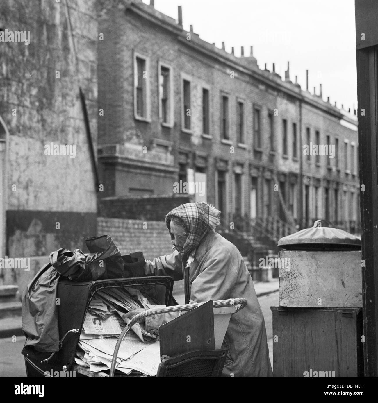 Recycling newspapers, Greater London, 1960-1965. Artist: John Gay Stock Photo