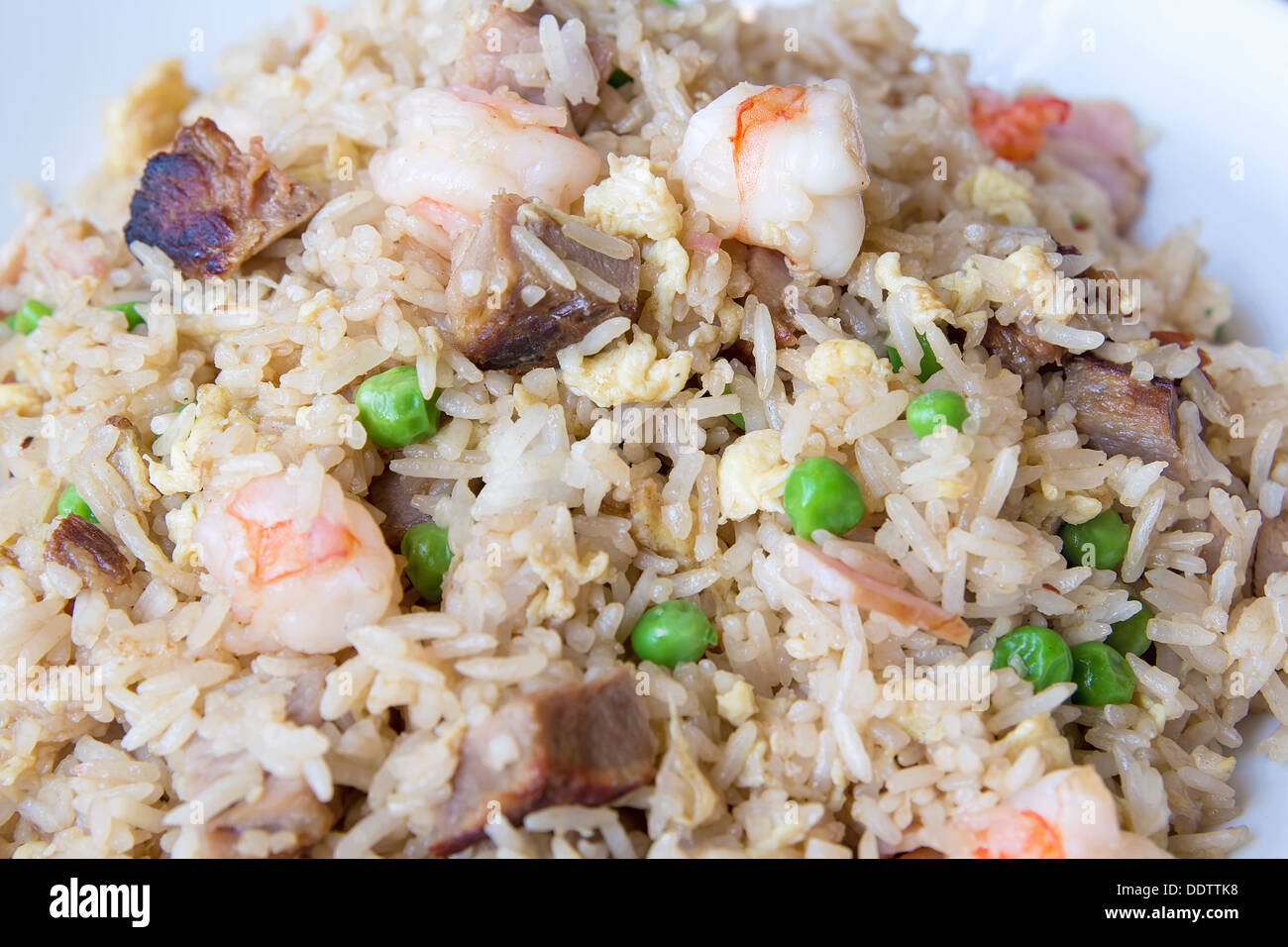 Yeung Chow Fried Rice with Barbecued Pork Prawns Green Peas Scallions and Eggs Closeup Macro Stock Photo