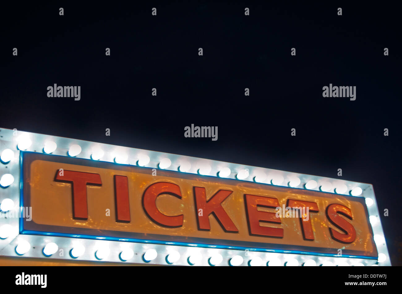 Ticket booth top at night with lights on. Stock Photo