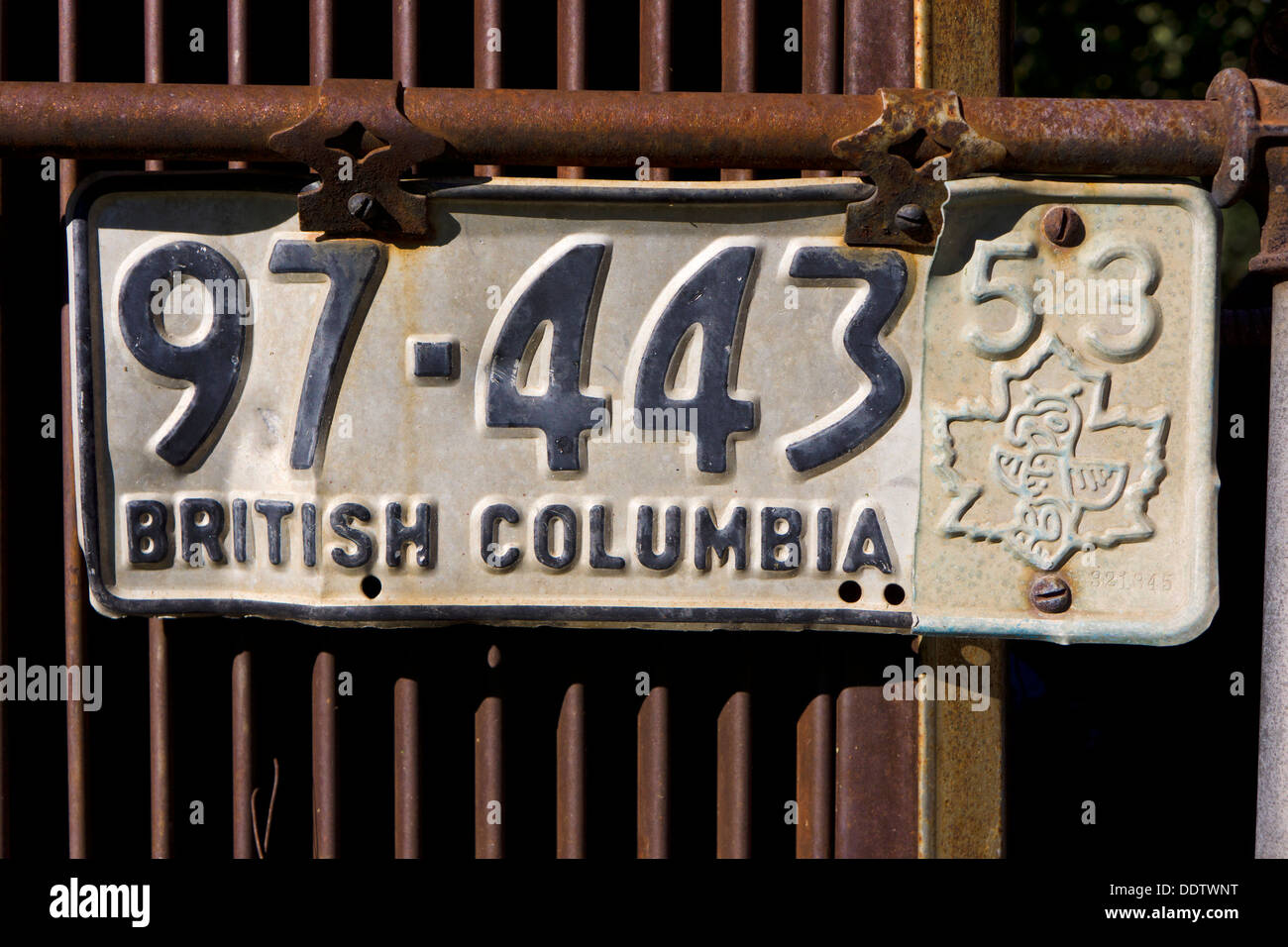1953 British Columbia passenger car license plate with totem in maple leaf. Stock Photo